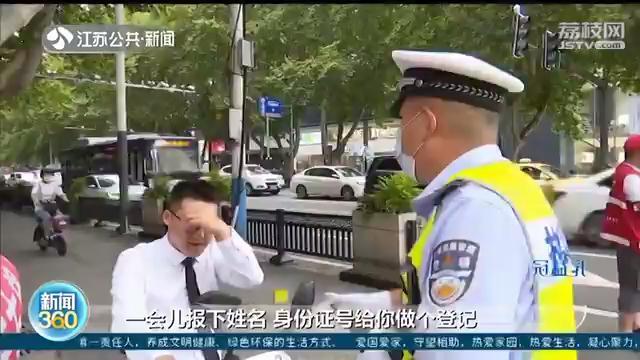 7月1号将至，记者南京路口实探：九成电动车主自觉佩戴头盔