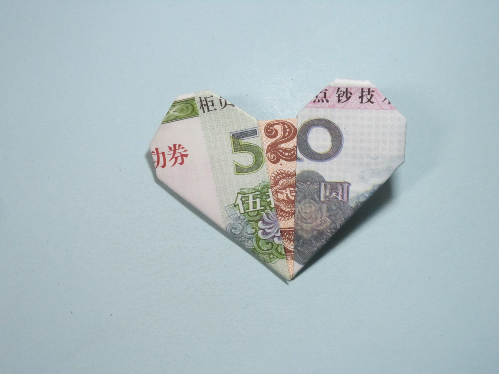 百元纸币折双心图片