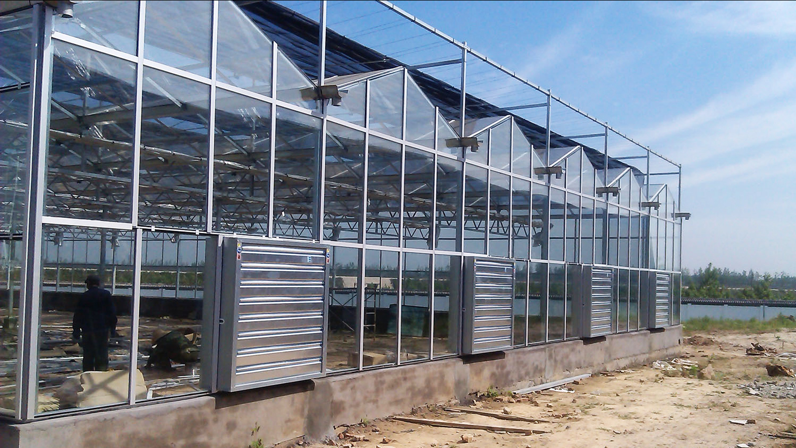玻璃温室通风降温系统工作原理是怎样的？农业种植为什么使用它